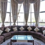 Ornate-draperies-and-a-plush-sectional-sofa