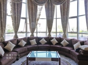 Ornate-draperies-and-a-plush-sectional-sofa